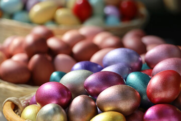 Colored Easter eggs in a basket. Colorful decorations, festive background