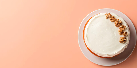 A round cake topped with cream and walnuts, displayed on a light peach background, emphasizing its texture and decoration.