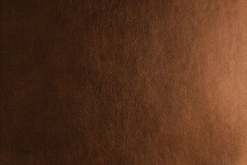 Glossy structure of genuine leather with gradient lighting effect, natural skin surface with embossing pattern. Artifical orange colored leatharette macro texture. Background, wallpaper, backdrop.
