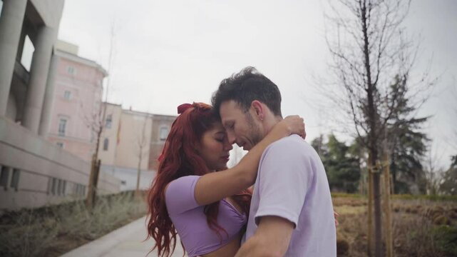 Passionate dancers performing latin dance routine in urban setting