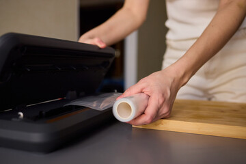 Hands Skillfully Preparing Vacuum Sealing for Food Preservation and Storage Purposes
