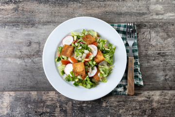 Fattoush salad, Traditional Lebanese Salad on wooden table. Top view