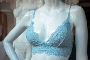 Closeup of blue bra on mannequin in a fashion store showroom