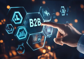 Businessman touching a virtual screen with the word B2B on it and icons of handshakes, gears, graphs, a target, and hexagons in the background