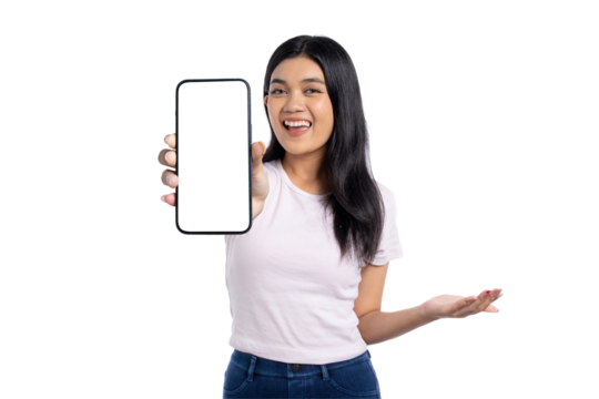 Happy young Asian woman holding a smartphone with blank screen, smiling and pointing, isolated on transparent background