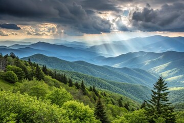 Fototapeta premium Dramatic Sunlight Beams over Layers of Green Appalachian Mountain Ridges and Stormy Clouds