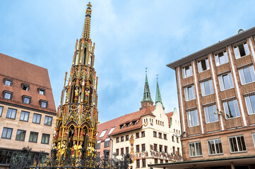 Nuremberg, Germany, August 1, 2023. Iconic shot of the magnificent market square. Highlighted is the golden fountain. Explore and discover Nuremberg. Travel destinations.