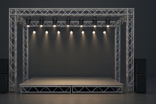 modern stage setup featuring metal truss structure with spotlights and speakers, ideal for performances and events