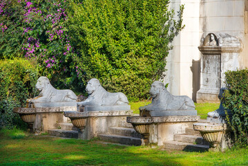 Villa Borghese gardens, Portico dei Leoni, stone lion sculptures in front of the entrance, Rome, Italy