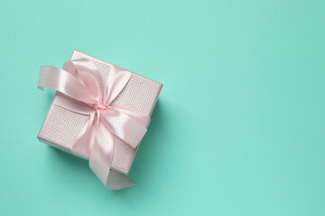 Beautiful gift box on color background