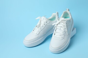 White sneakers on a colored background