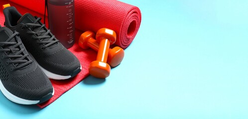 Sport equipment on blue background, top view