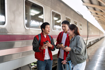 Coffee and Travel Vibes. Friends enjoying warm beverages while waiting for their train.