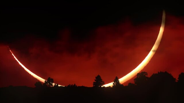 Epic cinematic shot of a huge crescent sun during a solar eclipse at sunset. Captured near the horizon with forest silhouette and intense colors. Scenic view for nature, science, or dramatic visuals.