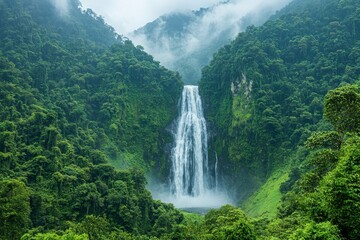 Fototapeta premium Breathtaking Waterfall in Lush Green Forest