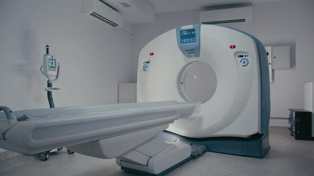 High-tech MRI scanner in pristine diagnostic room with table aligned precisely toward circular tunnel. Camera nearing device capturing details of sleek surface and control panel layout.