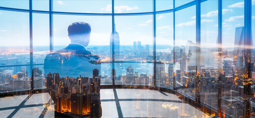 Double exposure image of a businessman looking out a window towards Hong Kong cityscape. The urban view blends with the person in a modern setting.