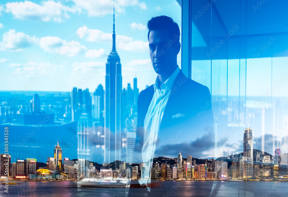 Aufkleber Double exposure showing a man in a suit merged with the vibrant Hong Kong cityscape. City lights and skyscrapers create a layered and dynamic image.