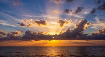 Golden Sunset Panorama Over Calm Ocean with Fluffy Clouds
