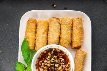 Nem rolls  sauce vietnamese rice paper roll gourmet food background on the table rustic food top view copy space