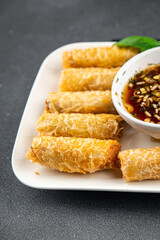 Nem rolls  sauce vietnamese rice paper roll gourmet food background on the table rustic food top view copy space