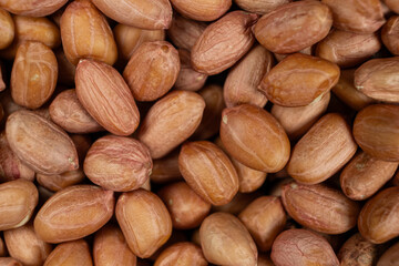 Raw brown peanuts macro view from above
