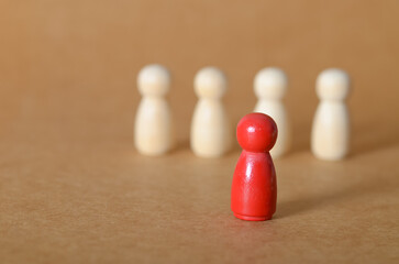 Leading the Way: A Bold Red Figure Among the Masses