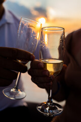 two glasses of wine at sunset 