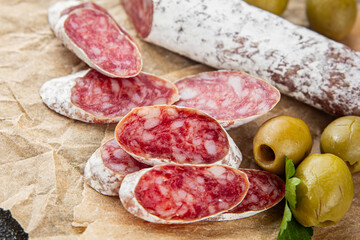 Fuet sausage meat Spanish delicacy gourmet food background on the table rustic food top view copy...