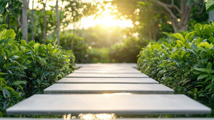 serene pathway of square stone pavers leads through lush greenery, illuminated by warm glow of setting sun. This tranquil scene invites relaxation and reflection
