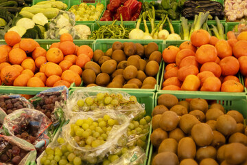 Fresh fruit and vegetables displayed in a neighborhood fruit shop