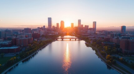 Obraz premium Golden Hour Aerial View of Downtown Denver, warm sunlight illuminating the skyline, casting long shadows over the river and bridge, vibrant urban landscape bathed in golden hues