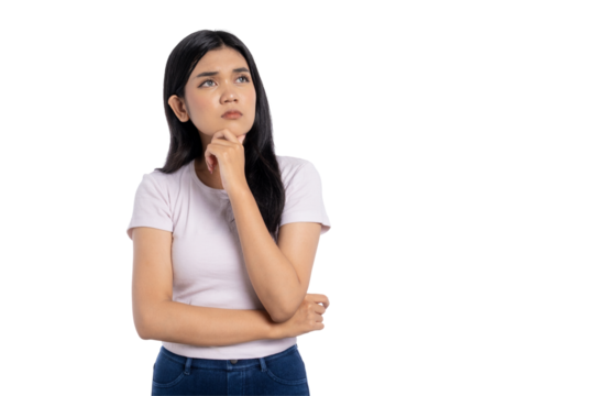 Thoughtful young Asian woman looking up with hand on chin, contemplating idea or making decision, isolated on transparent background
