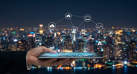 Smart City Technology: Futuristic Network of Connected Devices and Services on a Tablet Over a Night Cityscape
