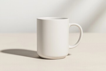 Obraz premium Minimalist design showcases plain white mug, casting soft shadow