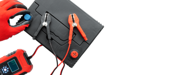Positive terminal and negative terminal of booster cables with car battery charging on AGM battery. Concept of battery or car recovery with error. Top view, with copy space, isolated background.