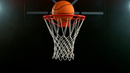 Freeze motion of basketball ball hitting the basket