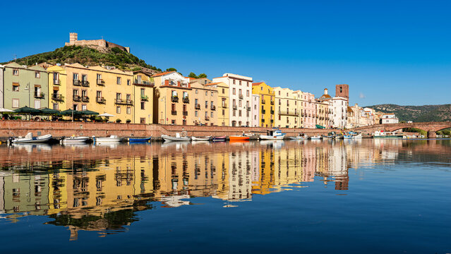 Bosa, Sardinia, Italy - View over the river Temo to the Ponte Vecchio bridge and the historic old town of Bosa with the castle of Serravalle in the background.