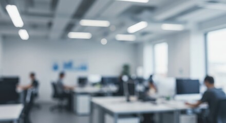 A blurred office space with desks, chairs, and people working in a modern and bright environment