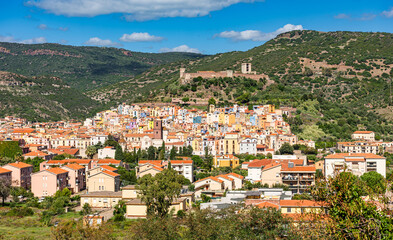 Panoramic view of the colorful buildings of Bosa and the Castle of Serravalle. Oristano, Sardinia, Italy