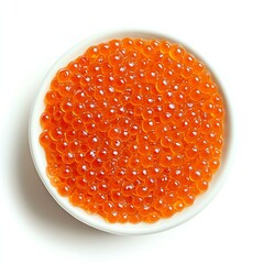 Sustainable caviar farming A close-up of vibrant orange fish roe presented in a white bowl.