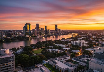 Obraz premium Cityscape view of brisbane australia at sunset with river and bridge and colorful sky above it all