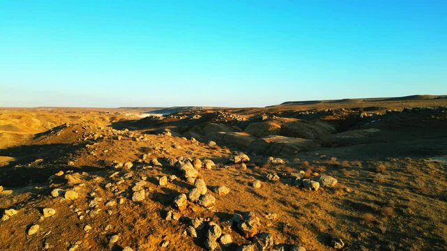 bottom upflight from a huge round stone in the distance a valley with round stones a gorgeous view of Kazakhstan