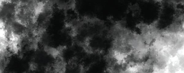 Dark artistic ink-washed background with abstract cloudy and grunge elements


