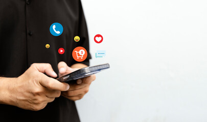 Man Using Smartphone with Social Media and Shopping Icons