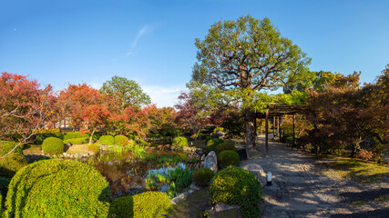Nature of Japan. Park in city Kofu. Autumn landscape with pond. Walking path in Japanese park. Kofu...