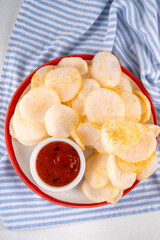 Crispy airy rice shrimp chips. Fragrant prawn crackers with sauce, traditional Asian fast food...
