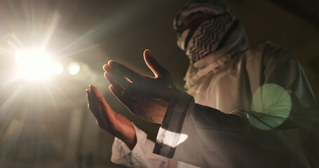 Muslim person, night or hands praying to worship for Palestine, low angle or support to Allah in holy temple. Dua, Islamic religion and asking God for spiritual guidance, blessing or Ramadan Kareem