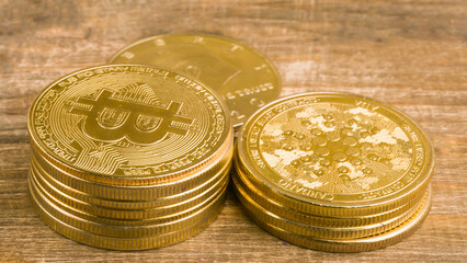 stacks of crypto coins on wooden background