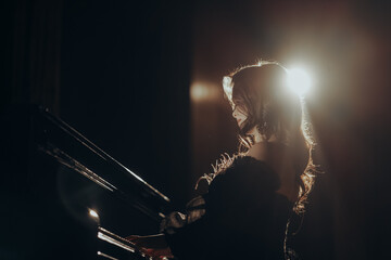 Silhouette of a Pianist woman in Spotlight